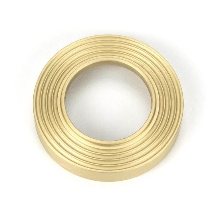 Close-Up of Beehive Backplate for Modern Satin Brass "Neville" Beehive Door Handle on Rose Set - 53mm Close-Up of Beehive Backplate for Modern Satin Brass "Neville" Beehive Door Handle on Rose Set - 53mm