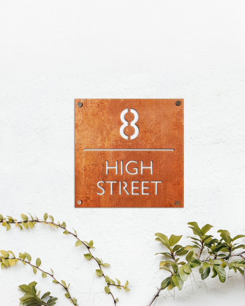 Modern Square Corten Steel House Number Sign in Situ on a White Wall Modern Square Corten Steel House Number Sign in Situ on a White Wall