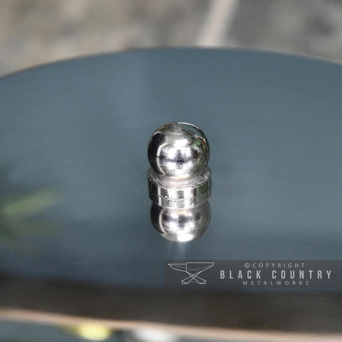 Close-up of the Ball Handle on the Top of the Lid