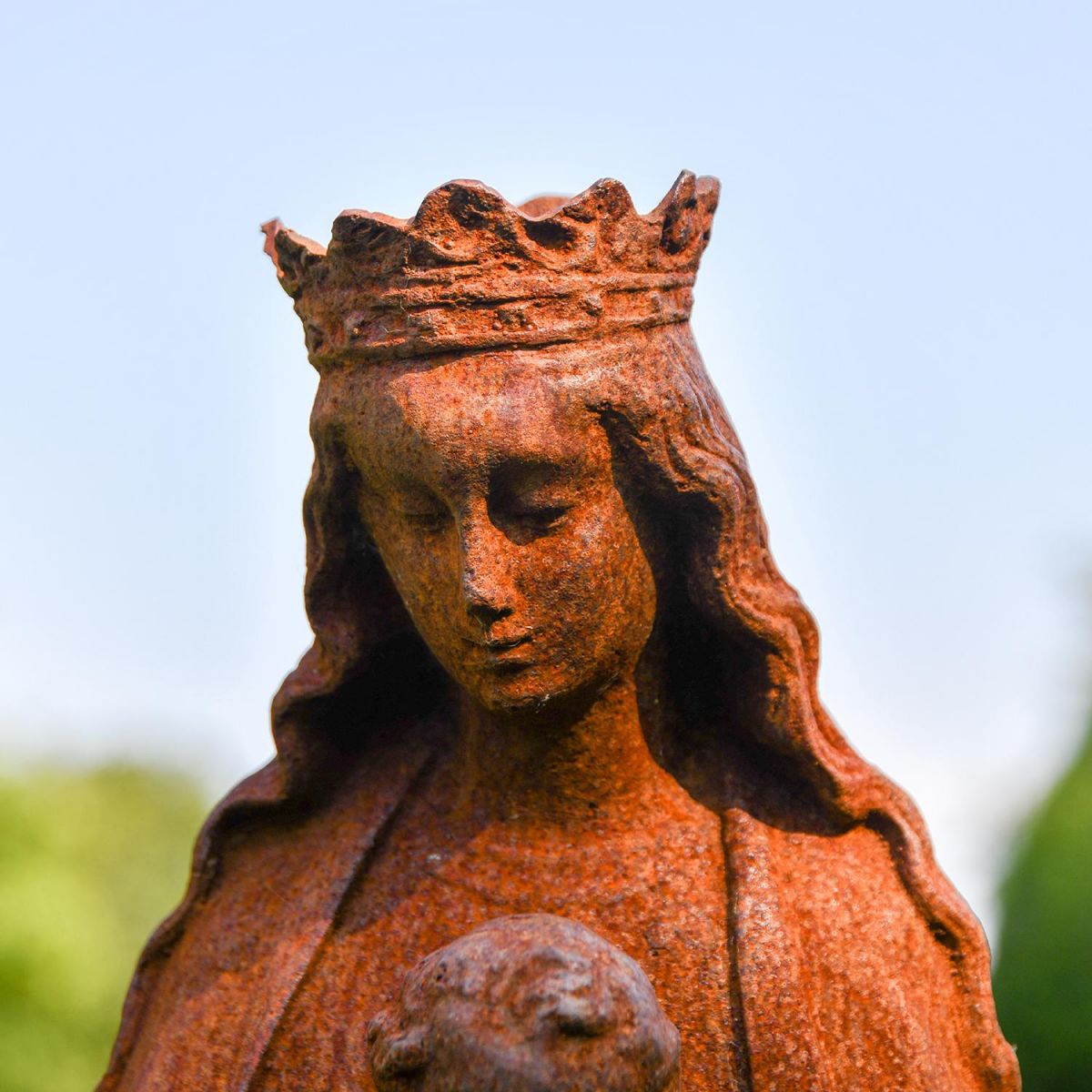 Close-up of the Face of the Mother Mary Holding Baby Cast Iron Sculpture 