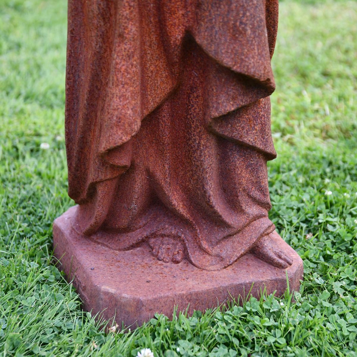 Close-up of the Base of the Mother Mary Holding Baby Cast Iron Sculpture 