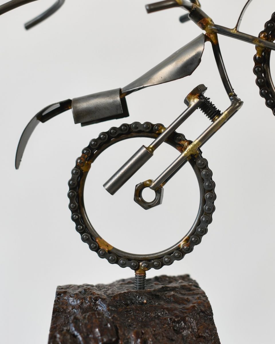 Close up of intricate motorbike detail on scrap metal art sculpture