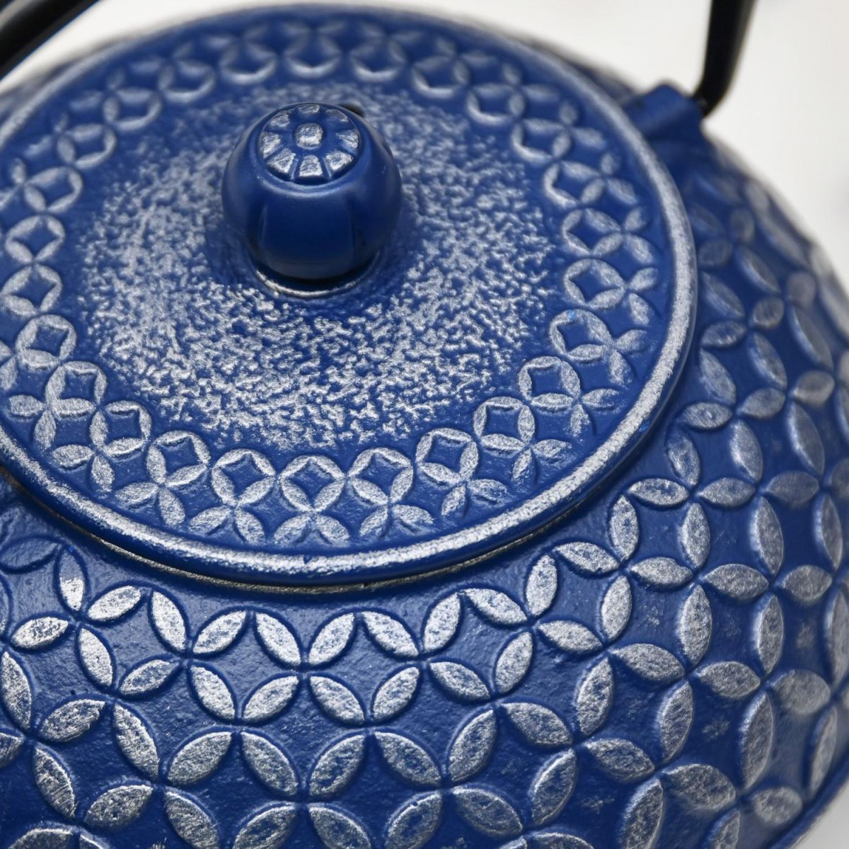 Close-Up of Blue Teapot with Closed Lid with Silver Pattern
