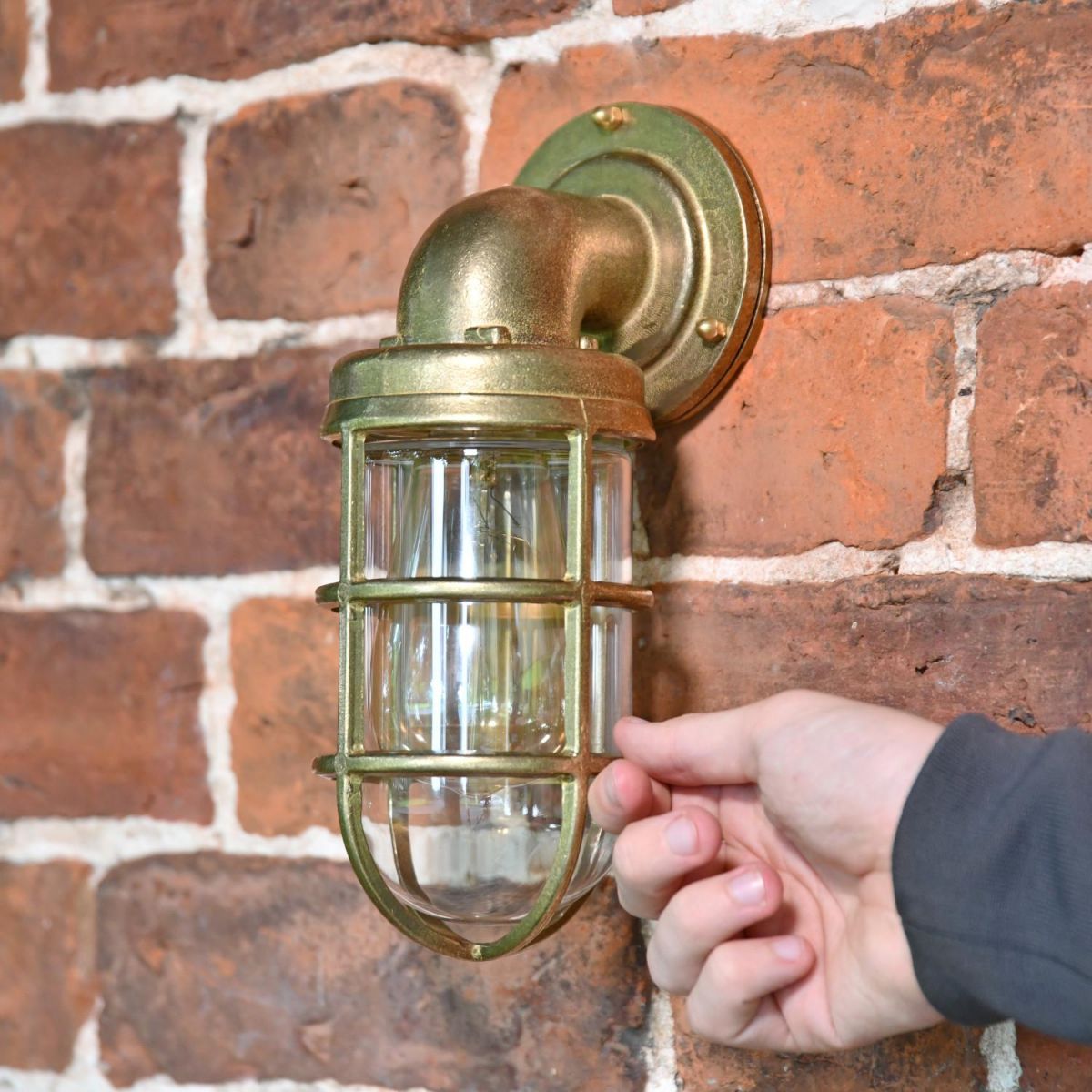 Scale Shot of Natural Brass Wall Mounted Down Light Scale Shot of Natural Brass Wall Mounted Down Light