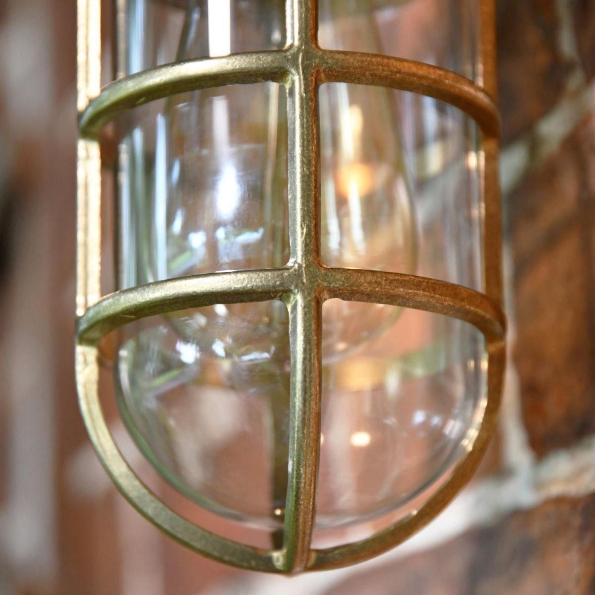 Close-Up of Caged Light in Natural Brass Finish Close-Up of Caged Light in Natural Brass Finish