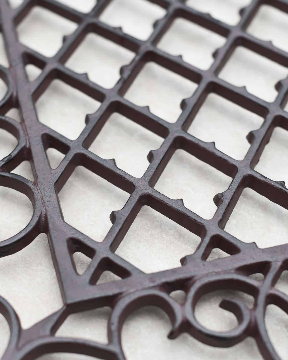 Close-Up of Cast Iron Frame on Rectangular Doormat