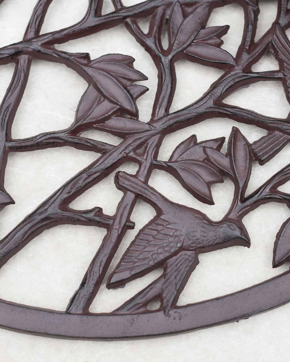 Close-Up of Birds in Flight on Cast Iron Arched Doormat in Situ