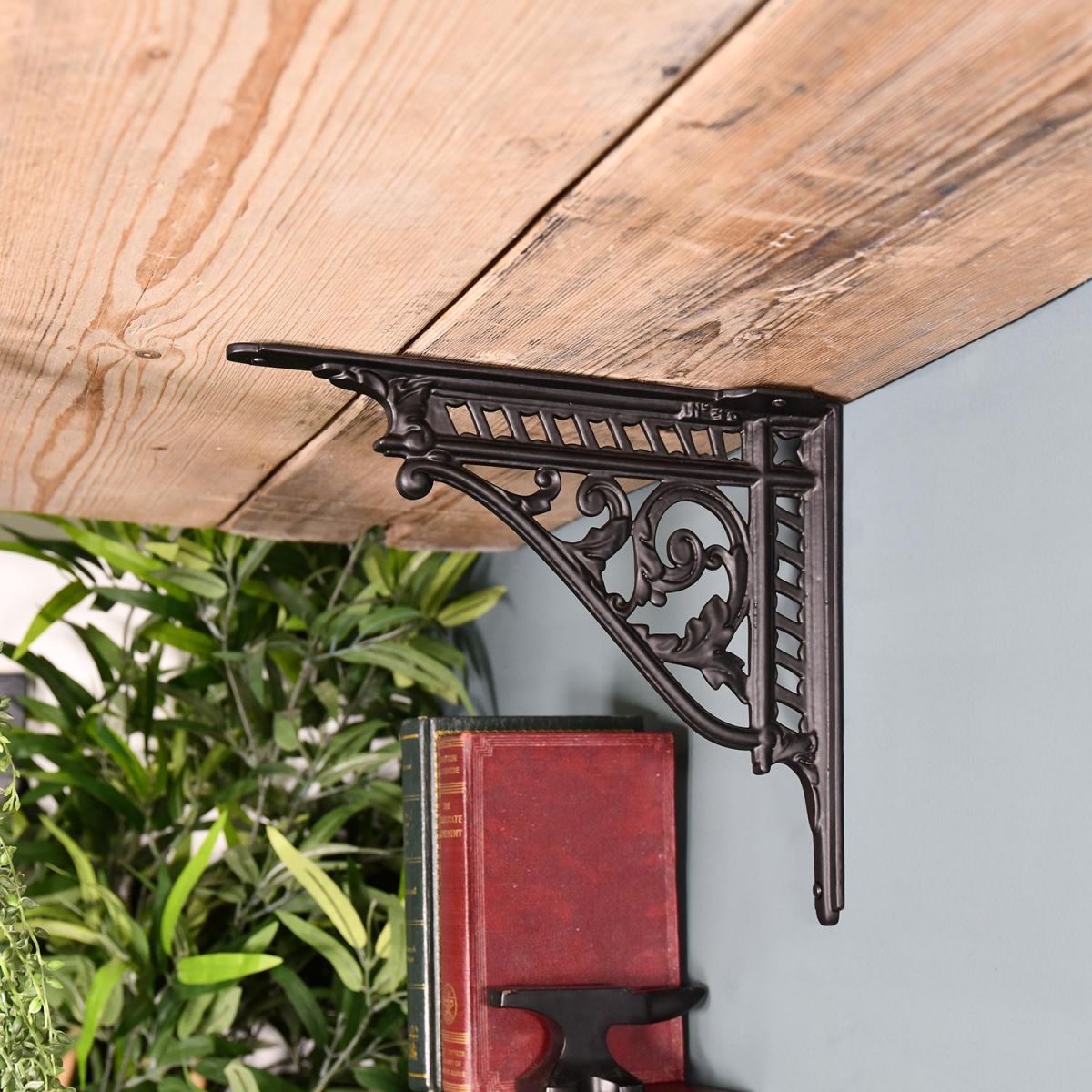 Black Shelf Bracket in Situ Holding a Wooden Shelf