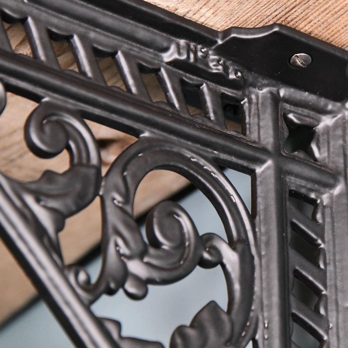 Ornate Design on the Black Shelf Bracket