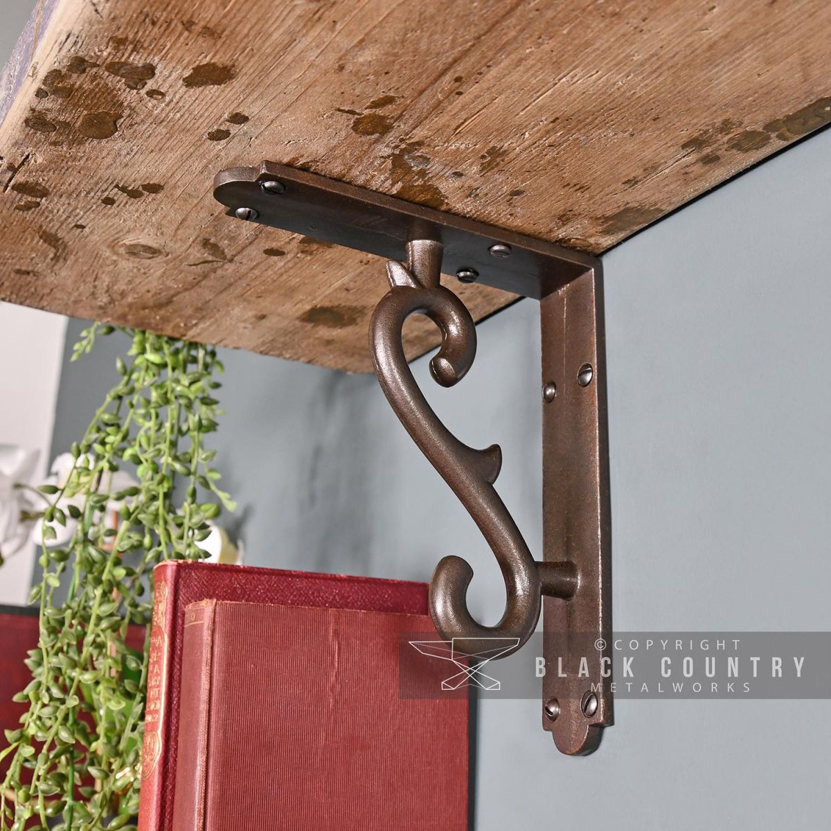 Natural Iron Scroll Shelf Bracket in Situ Holding a Wooden Shelf