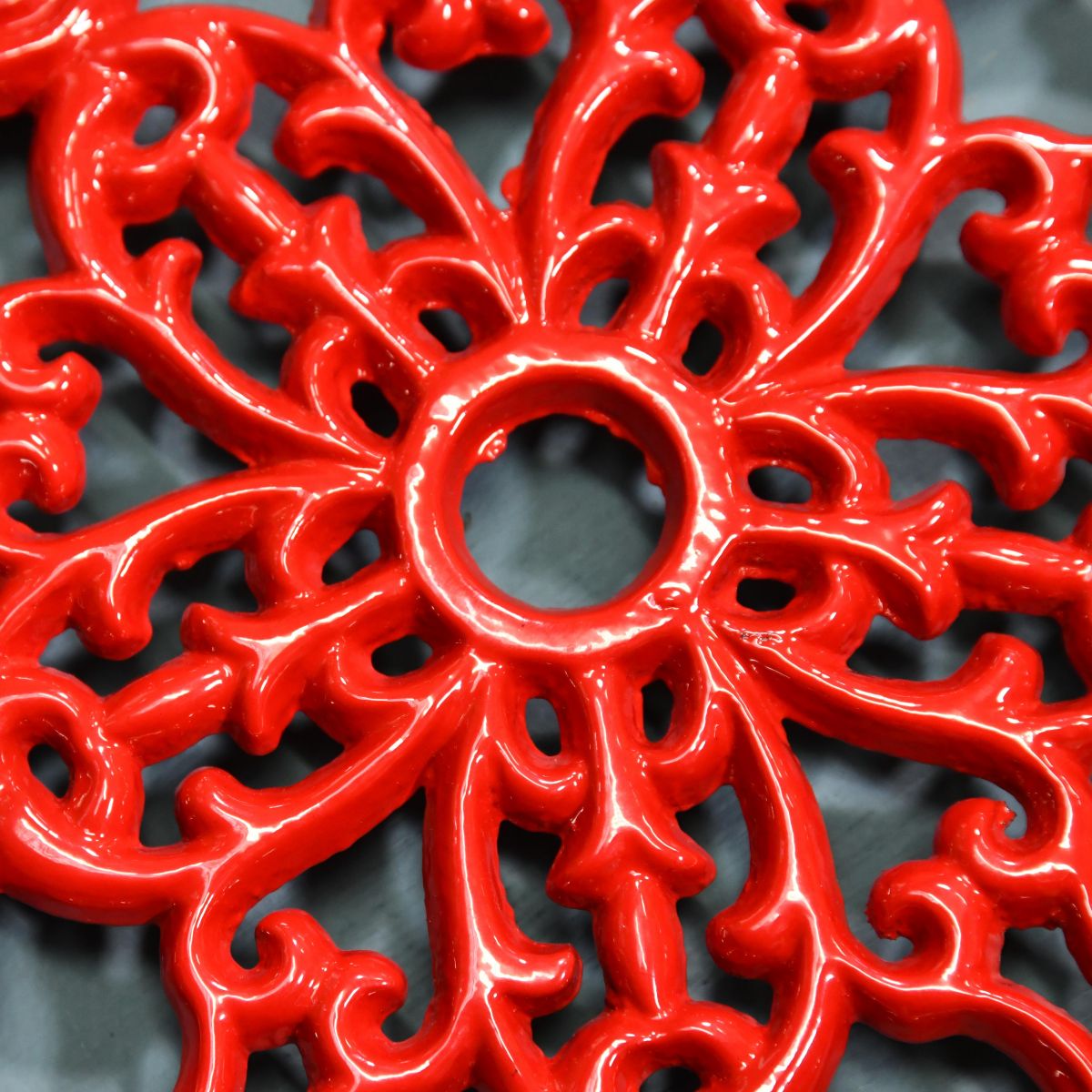 Red Cast Iron Flower Petal Trivet Centre Detailing Red Cast Iron Flower Petal Trivet Centre Detailing