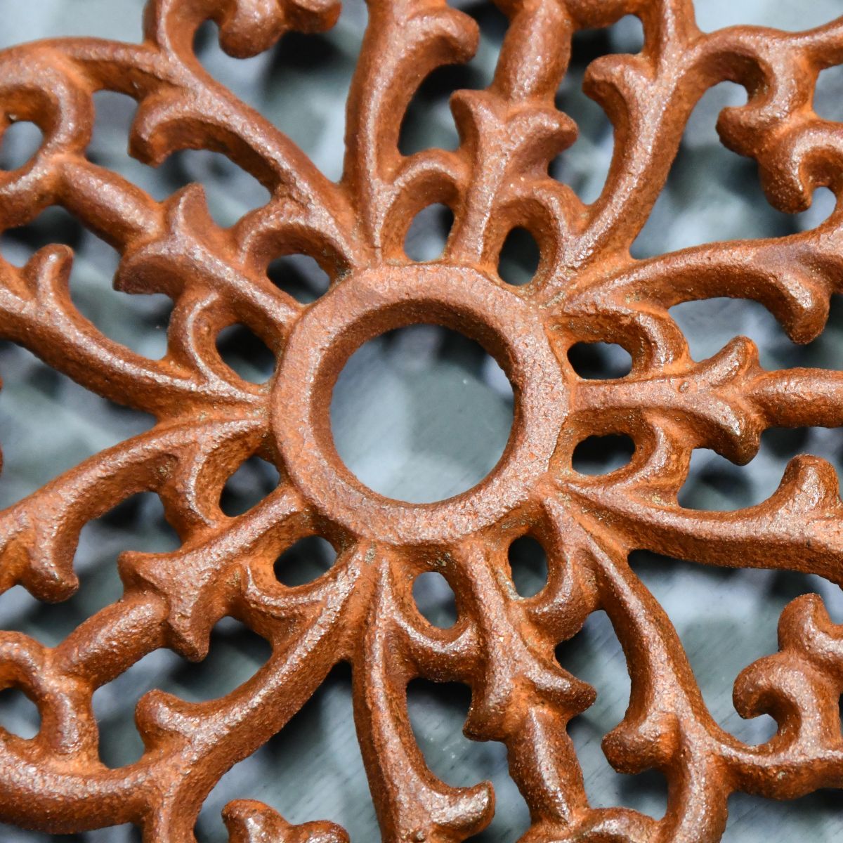 Rustic Cast Iron Flower Trivet Centre Close-Up Rustic Cast Iron Flower Trivet Centre Close-Up