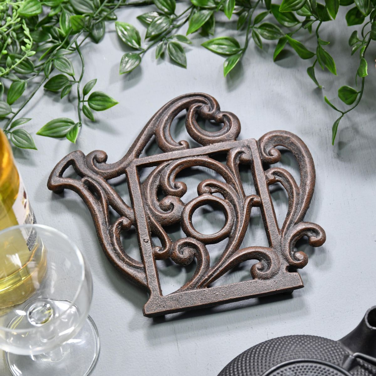 Rustic Kettle Shaped Cast Iron Trivet in Situ Rustic Kettle Shaped Cast Iron Trivet in Situ