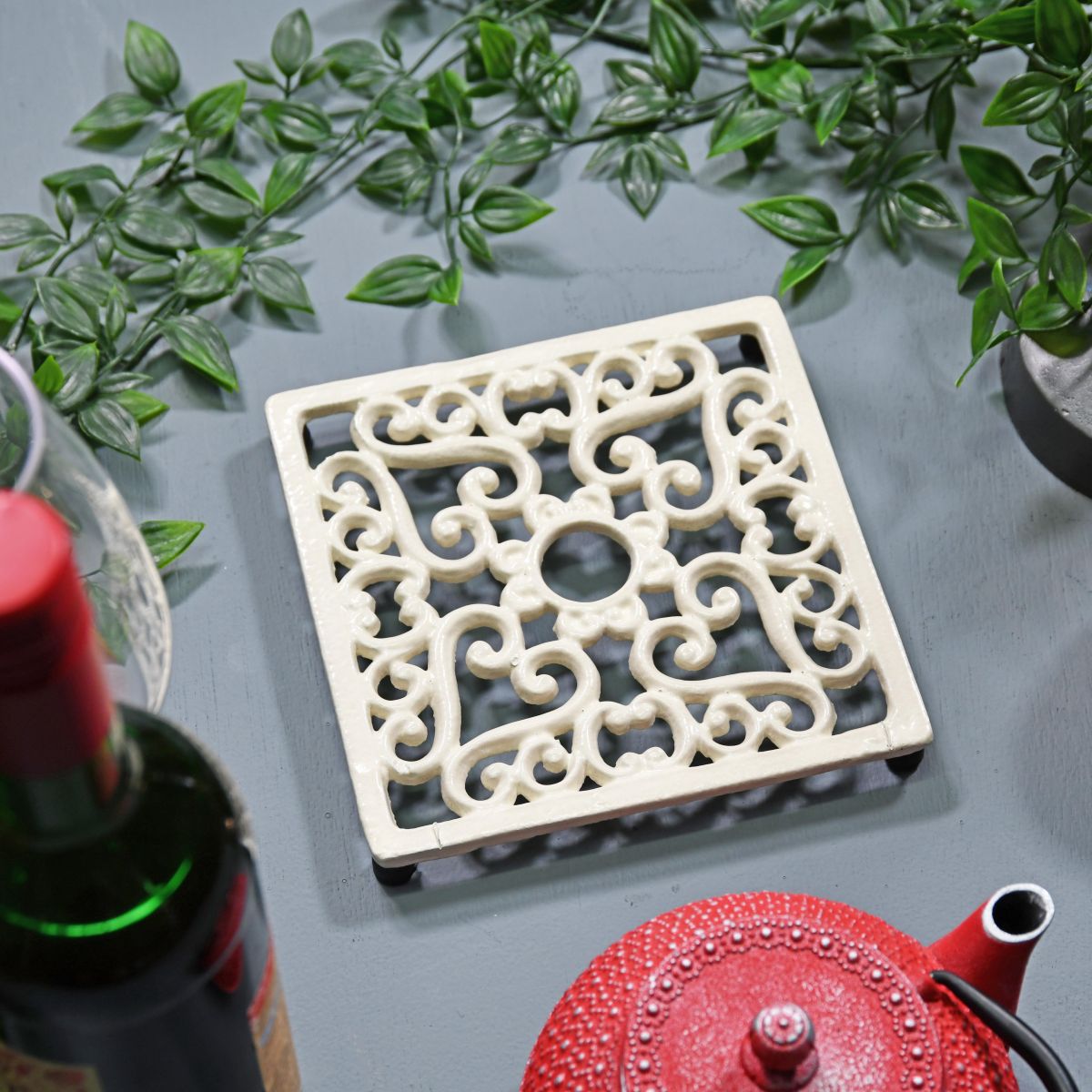 Cream Cast Iron Square Trivet in Situ with Teapot