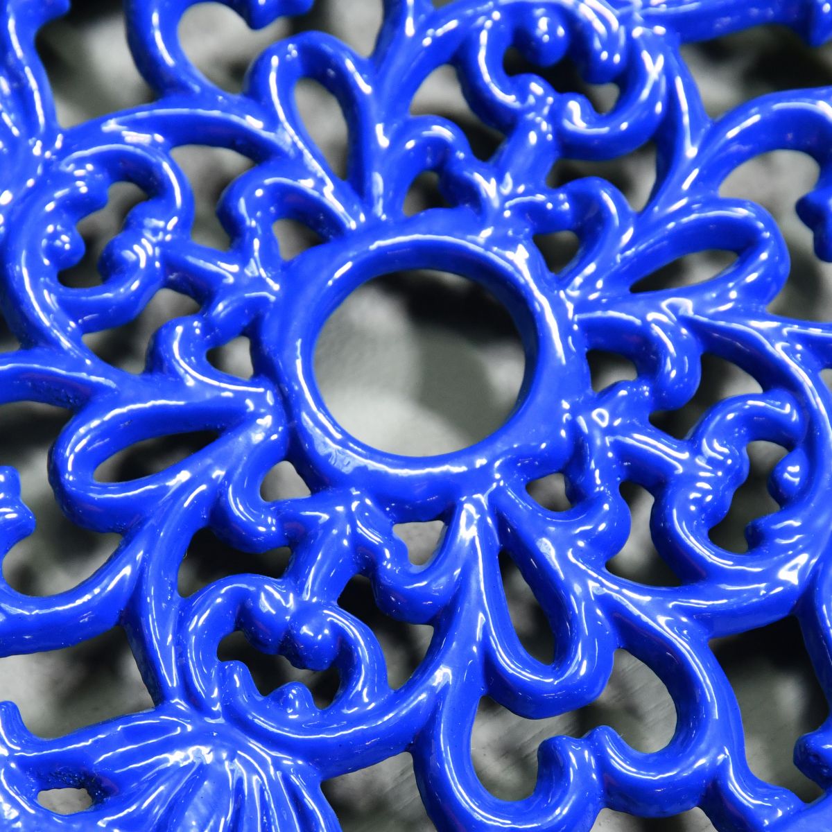 Blue Round Cast Iron Trivet Close-Up