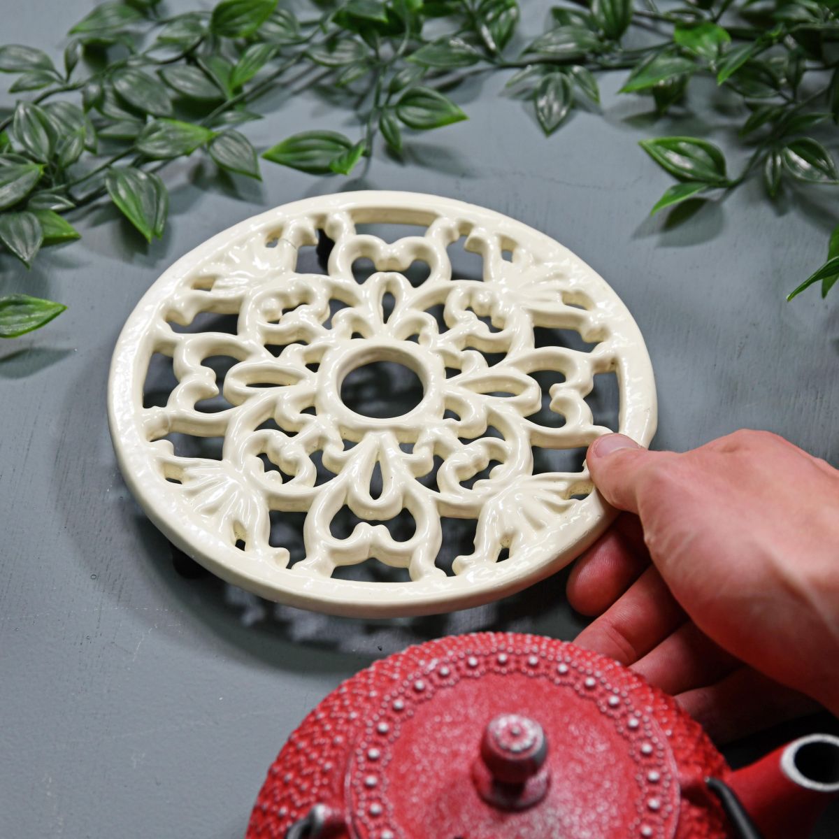 Cream Round Cast Iron Trivet to Scale