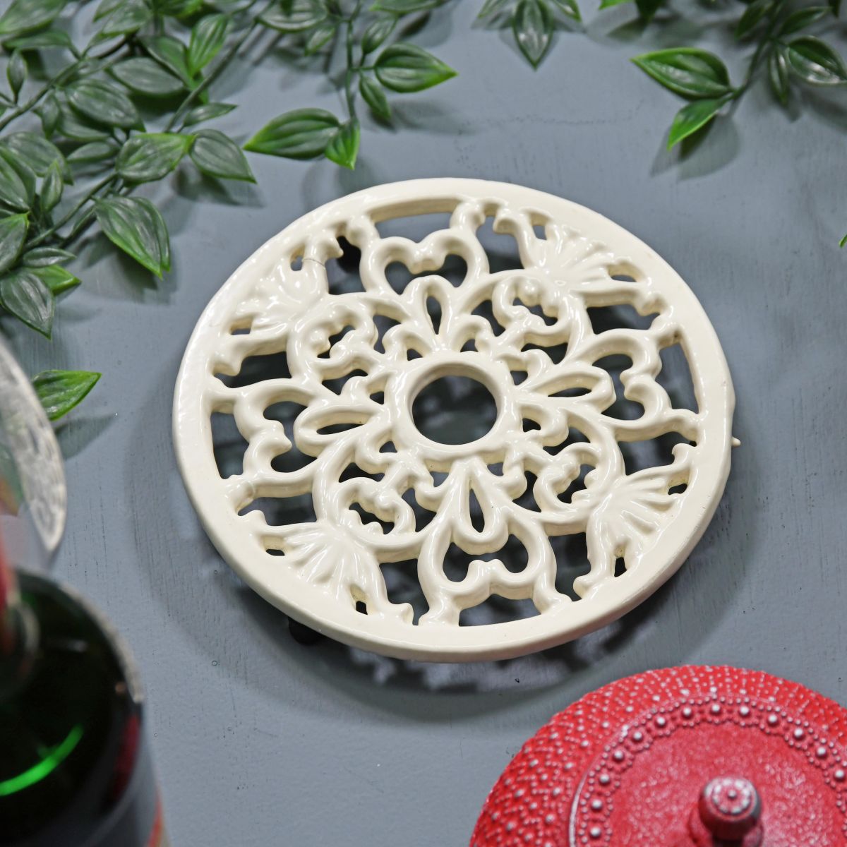 Cream Round Cast Iron Trivet in Situ