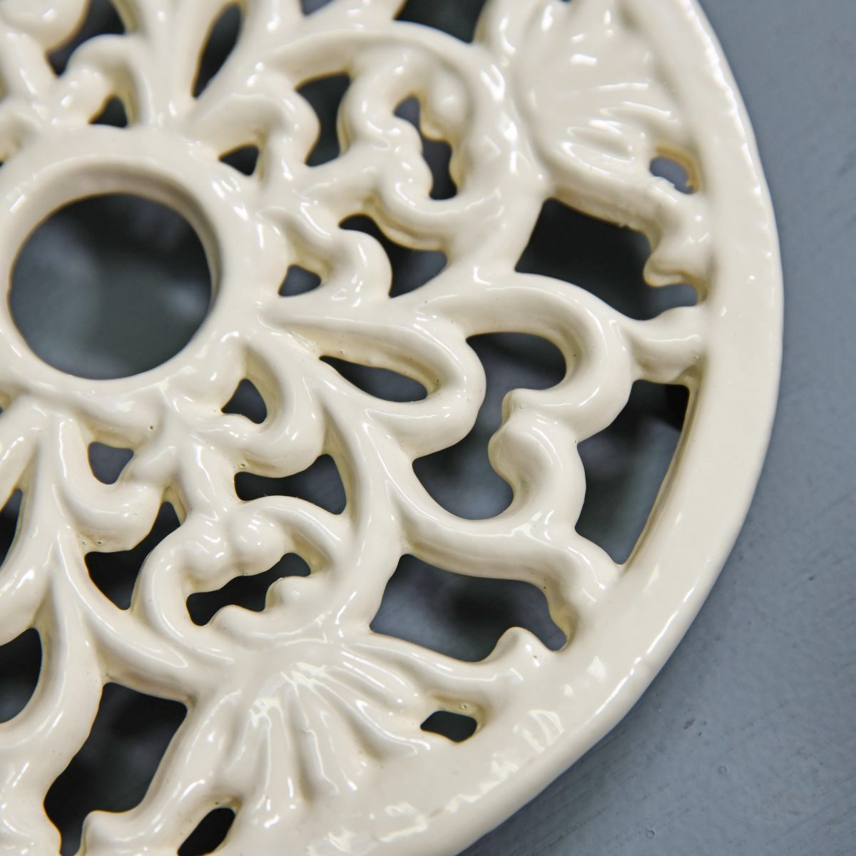 Cream Round Cast Iron Trivet Close-Up