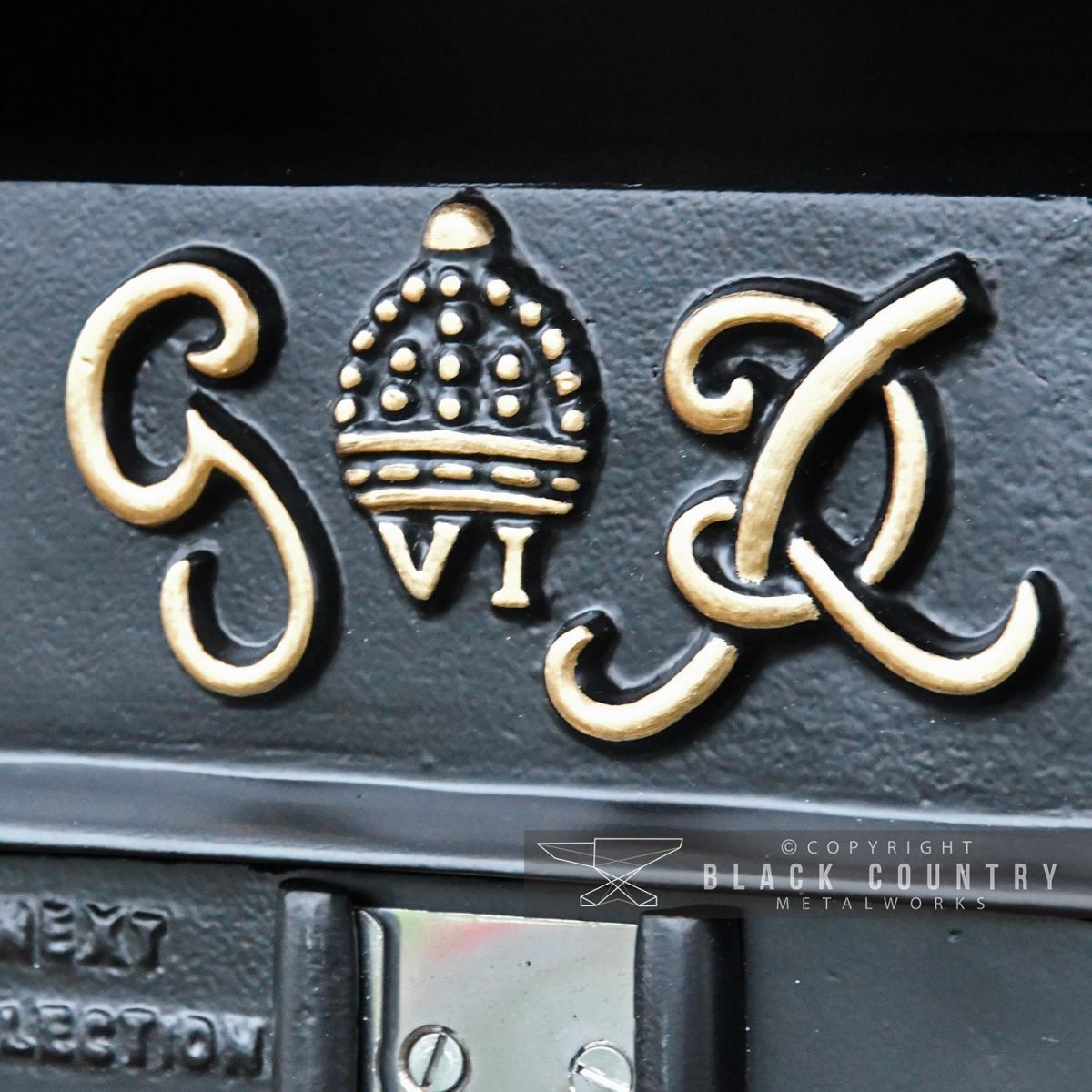 Close-up of the G.R Embossed Design on the Post Box