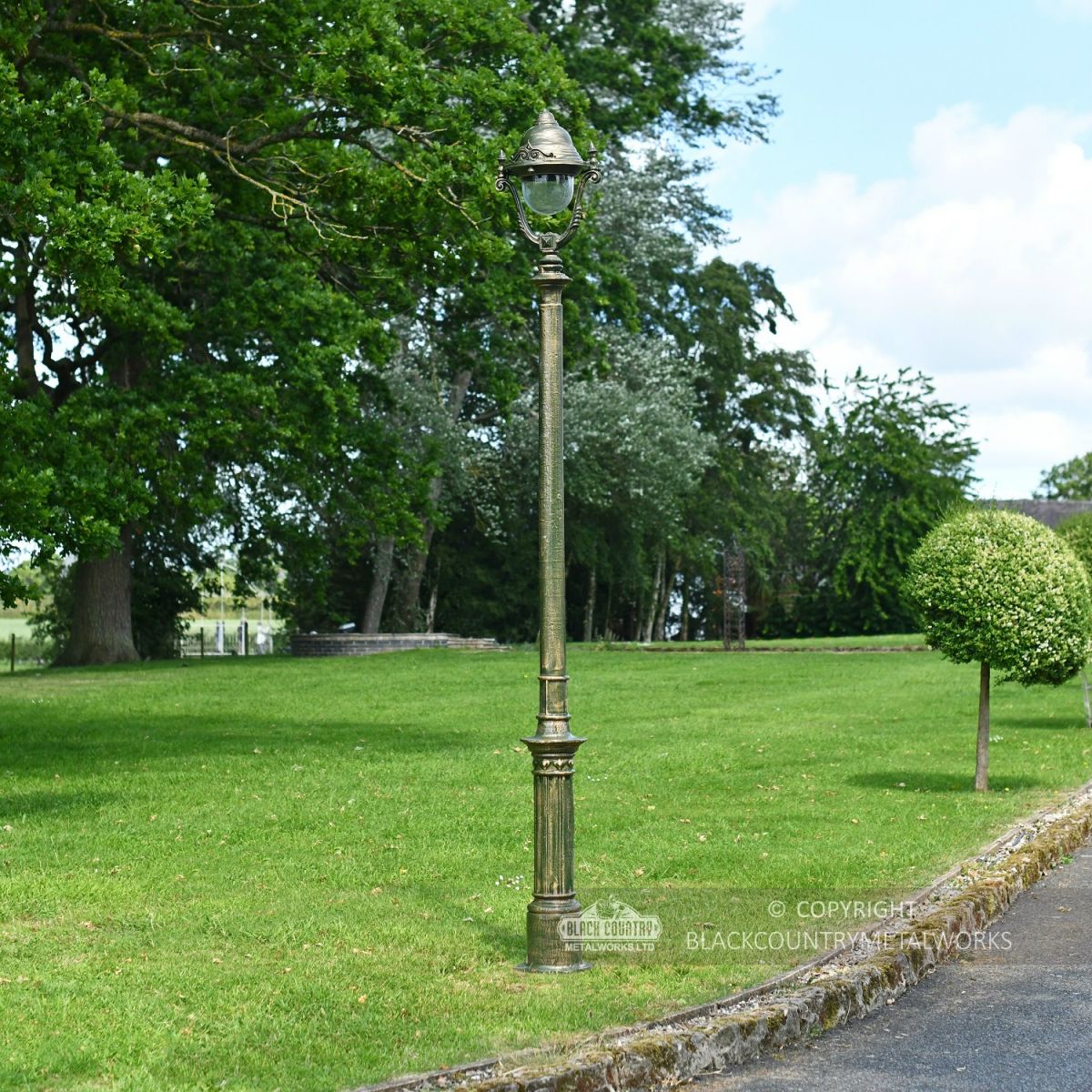 Olive Green Opulent Cast Iron Lamp Post In Garden Setting