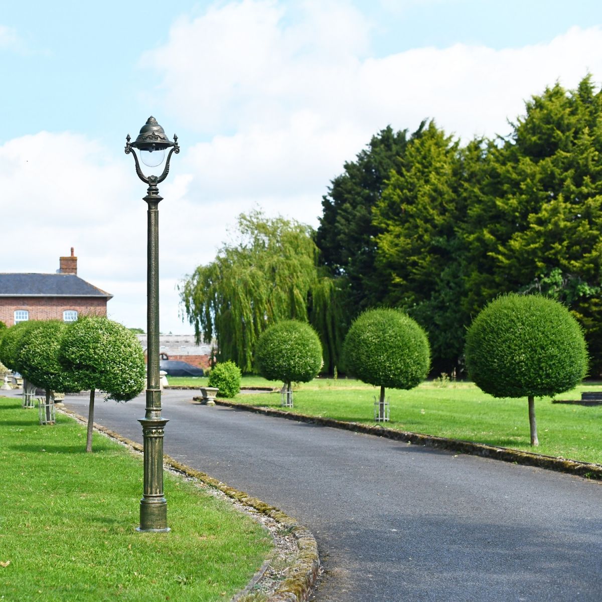 Olive Green Opulent Cast Iron Lamp Post Installed On Driveway