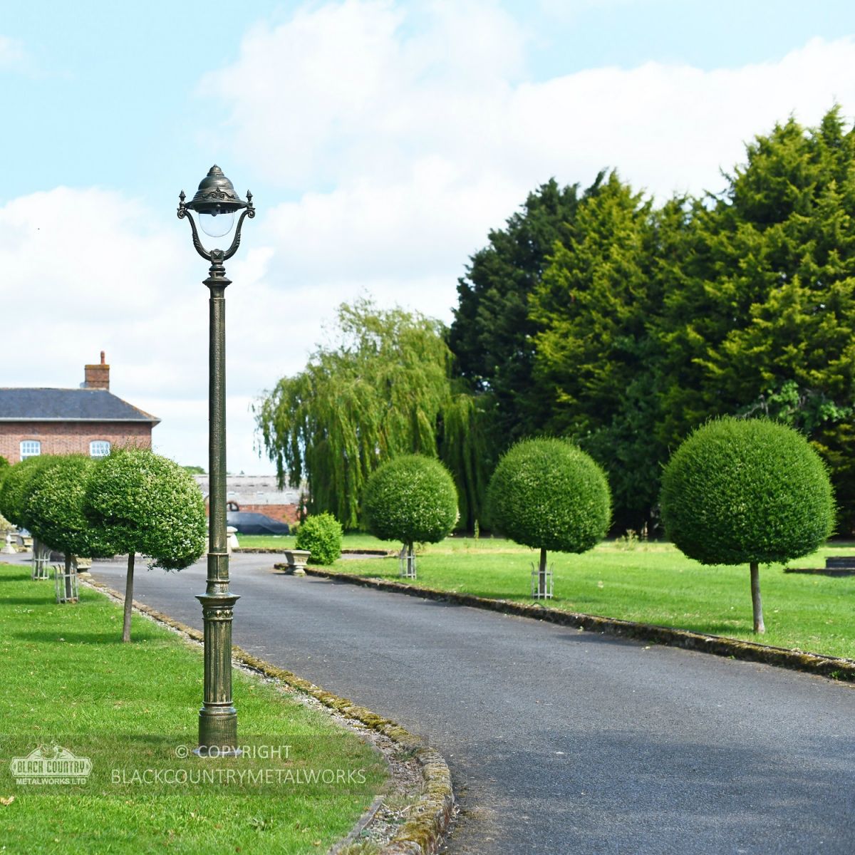 Olive Green Opulent Cast Iron Lamp Post Installed On Driveway