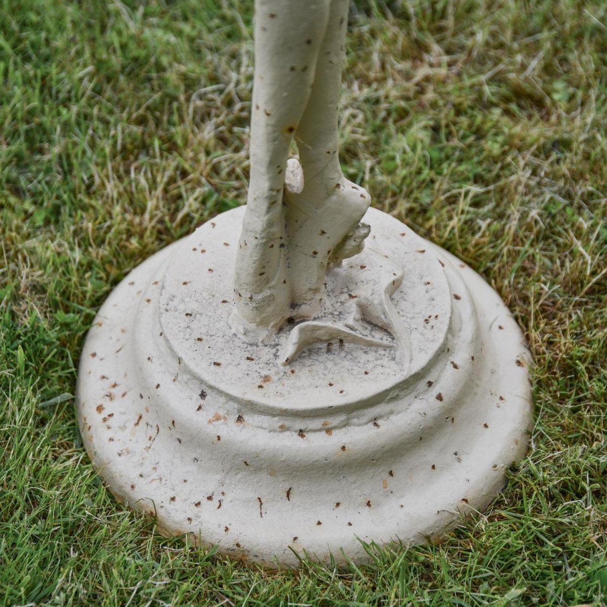 Close up of Base on Rustic Cream Cast Iron Ballet Dancer Garden Sculpture
