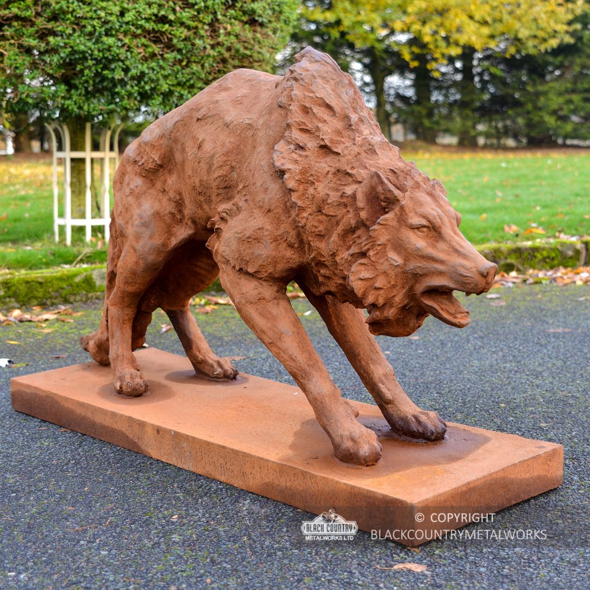 Cast Iron Wolf Sculpture with Arched Back Finished in a Rustic Finish  Cast Iron Wolf Sculpture with Arched Back Finished in a Rustic Finish