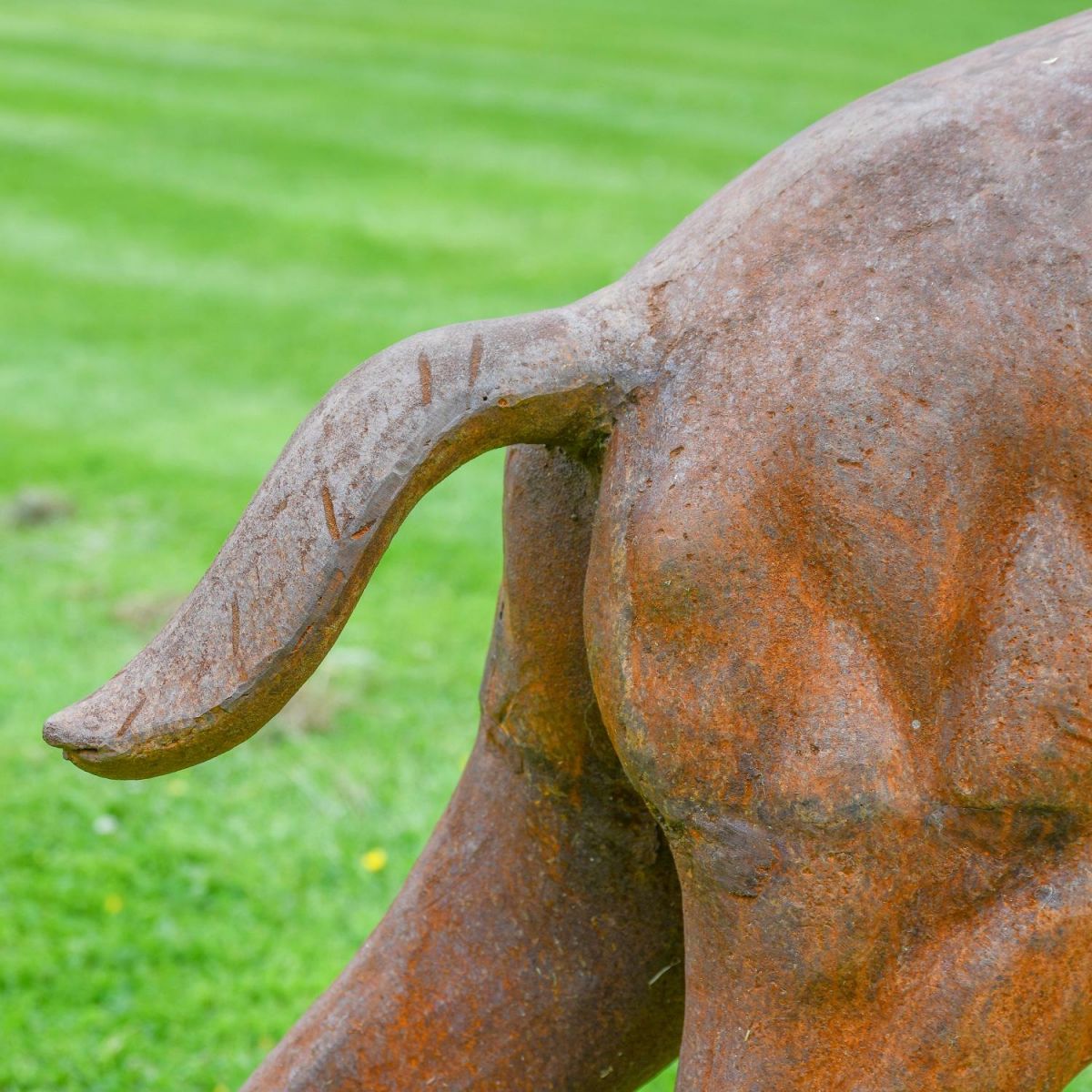 Close up cast iron stag sculpture tail