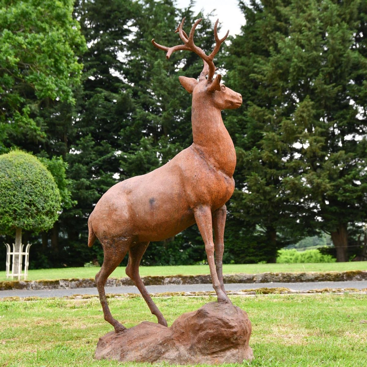Rear view of cast iron stag on rock sculpture