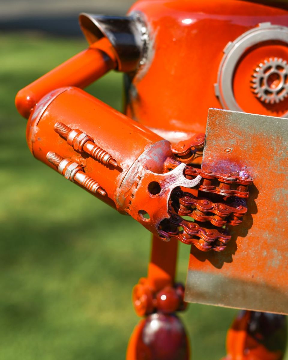 Close up of orange robot hand Close up of orange robot hand