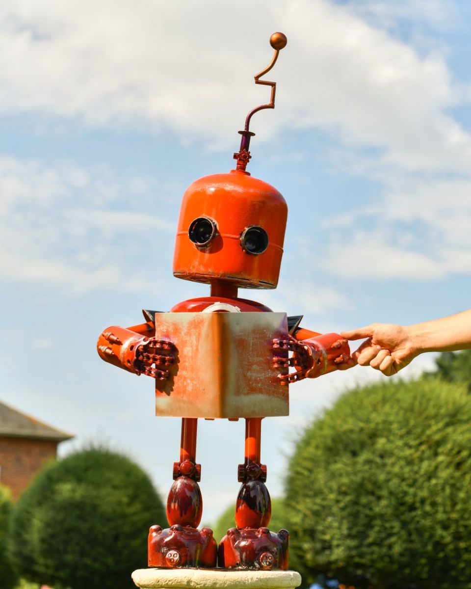 Scale image of Orange Recycled Metal Robot Sculpture Scale image of Orange Recycled Metal Robot Sculpture