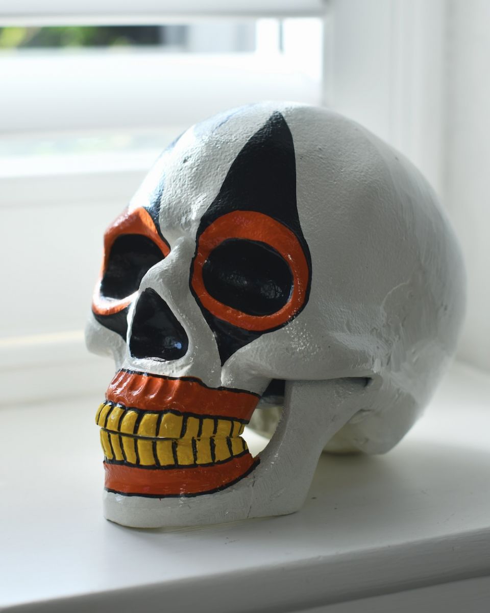 Orange Clown Skull Ornament on an angle