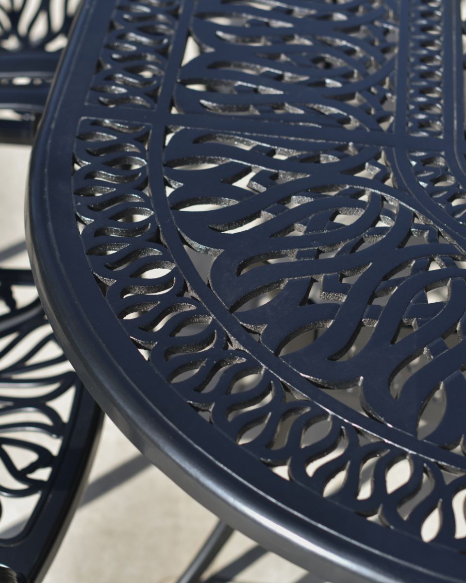 Close Up Of The Ornate Design On The Table From The Eight Seat Dining Set