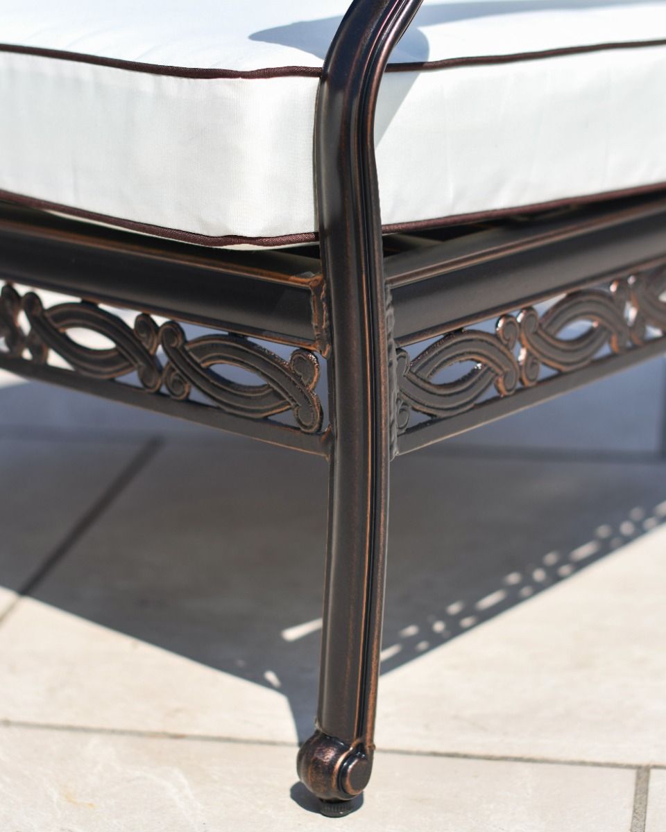 Close up of the ornate legs of the sofa and chairs.