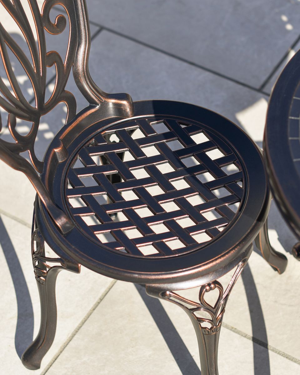 Antique Bronze "Lattice" Design on the Seat of the Chairs
