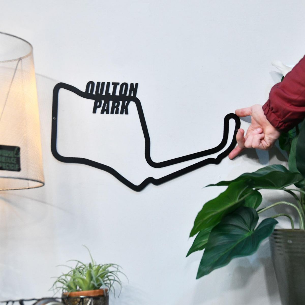 Oulton Park Motor Circuit on Wall with hand for scale