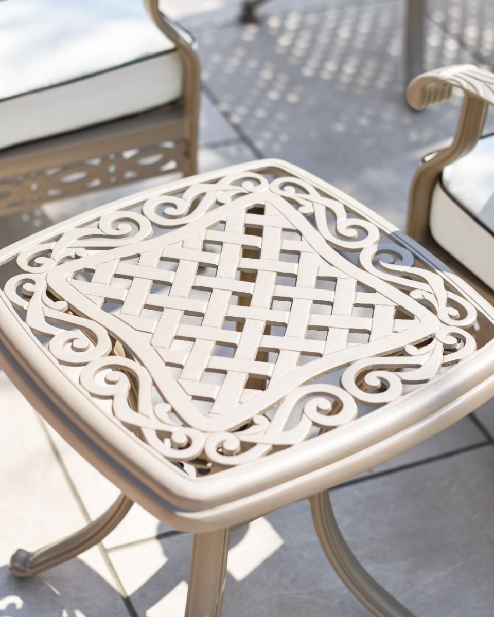 Close up shot of side table showing the lattice pattern and scrollwork detailing
