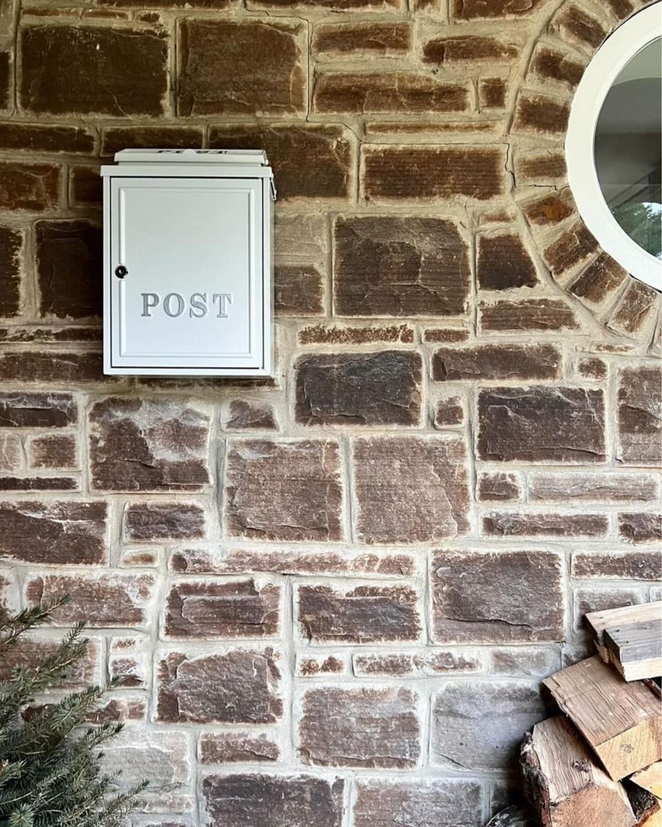 Wall Mounted Post Box On Stone Wall 