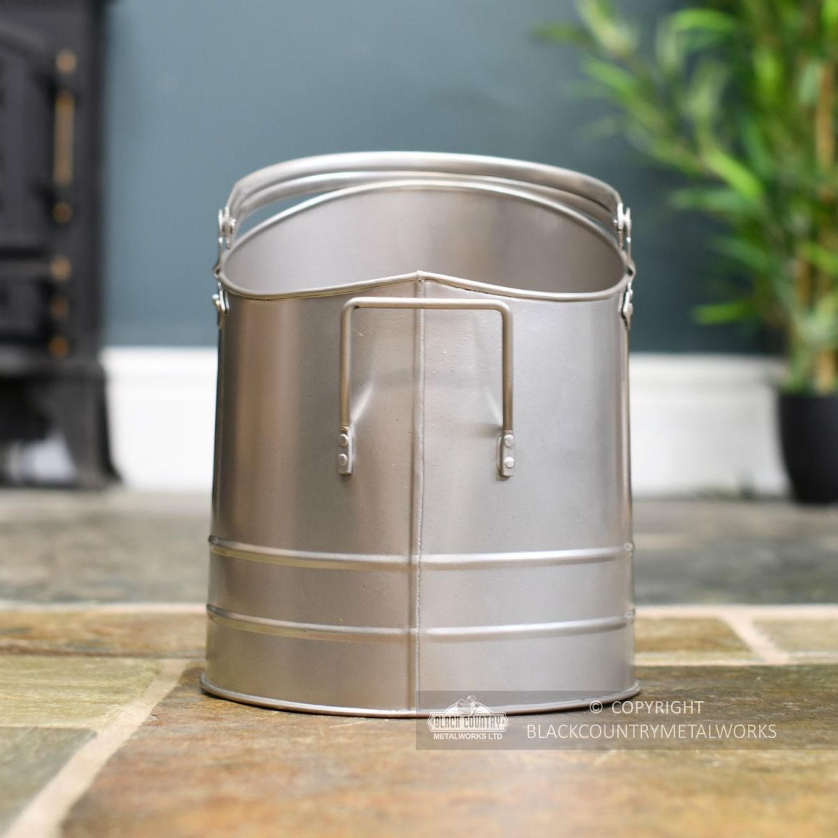 View of the Back of the Pewter Finish Traditional Fireside Log and Coal Bucket View of the Back of the Pewter Finish Traditional Fireside Log and Coal Bucket