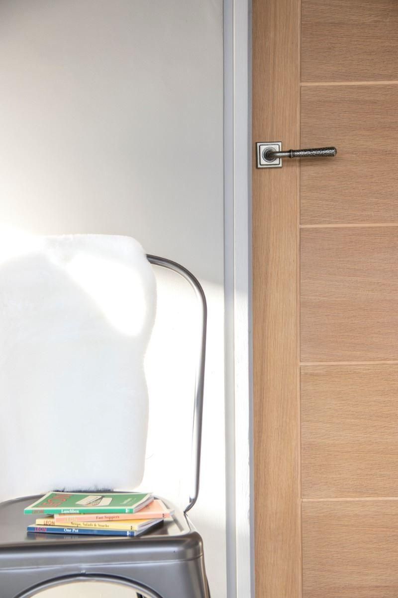 Pewter Hammered Lever Door Handle on Square Rose in Situ