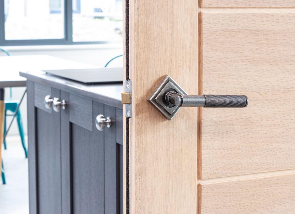 Pewter Textured Lever Door Handle on Diamond Rose on Door