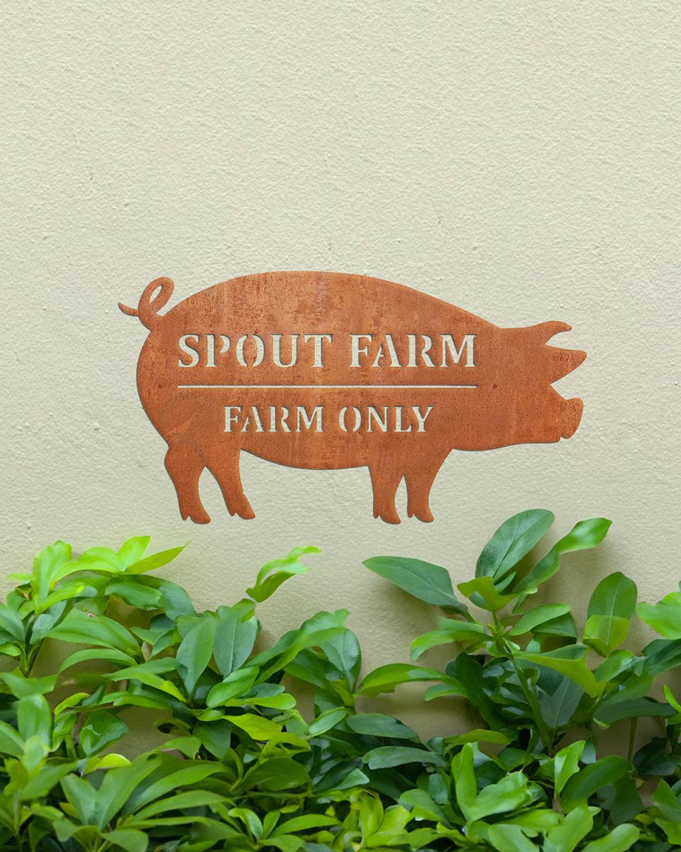 Pig Corten Steel House Name Sign in Situ on a Painted House Wall