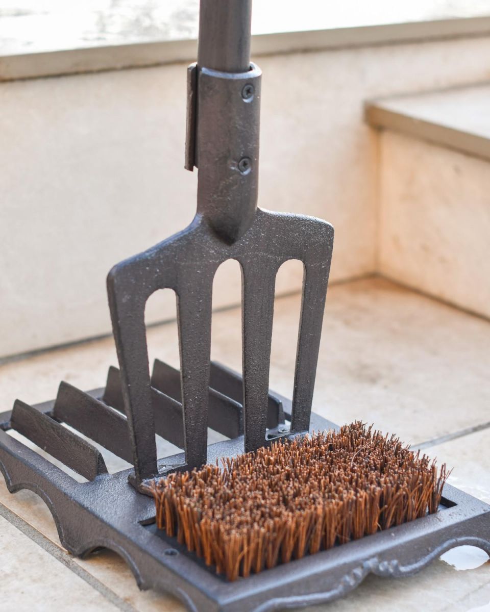 Close-Up of Pitch Fork Boot Brush & Scraper with Red Handle