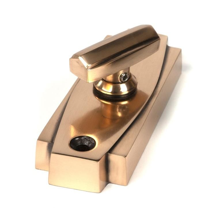 Close-Up of Polished Brass Art Deco Bathroom Thumb Lock Close-Up of Polished Brass Art Deco Bathroom Thumb Lock