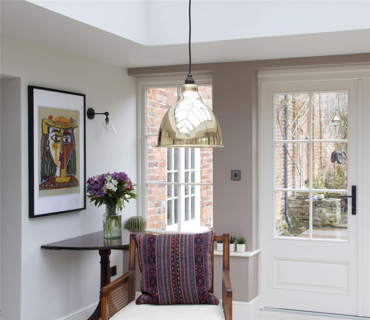Polished Brass Bowl-Shaped Hanging Pendant Light with Hammered Brass Interior in Situ