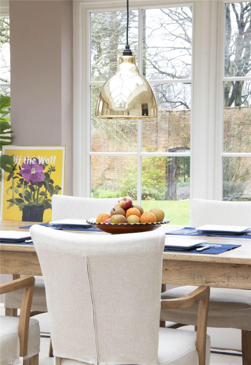 Polished Brass Bowl-Shaped Hanging Pendant Light with Smooth Brass Interior in Situ