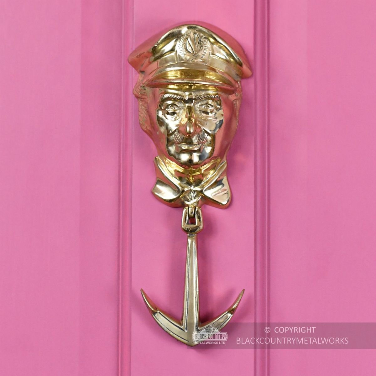 Polished Brass Captain Door Knocker On Pink Door