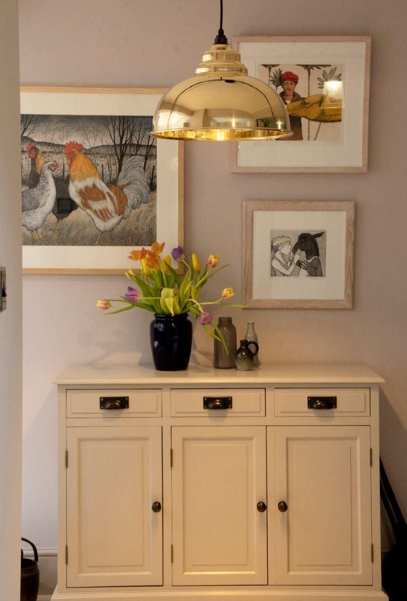 Polished Brass Curved Hanging Pendant Light with Smooth Brass Interior in Lounge