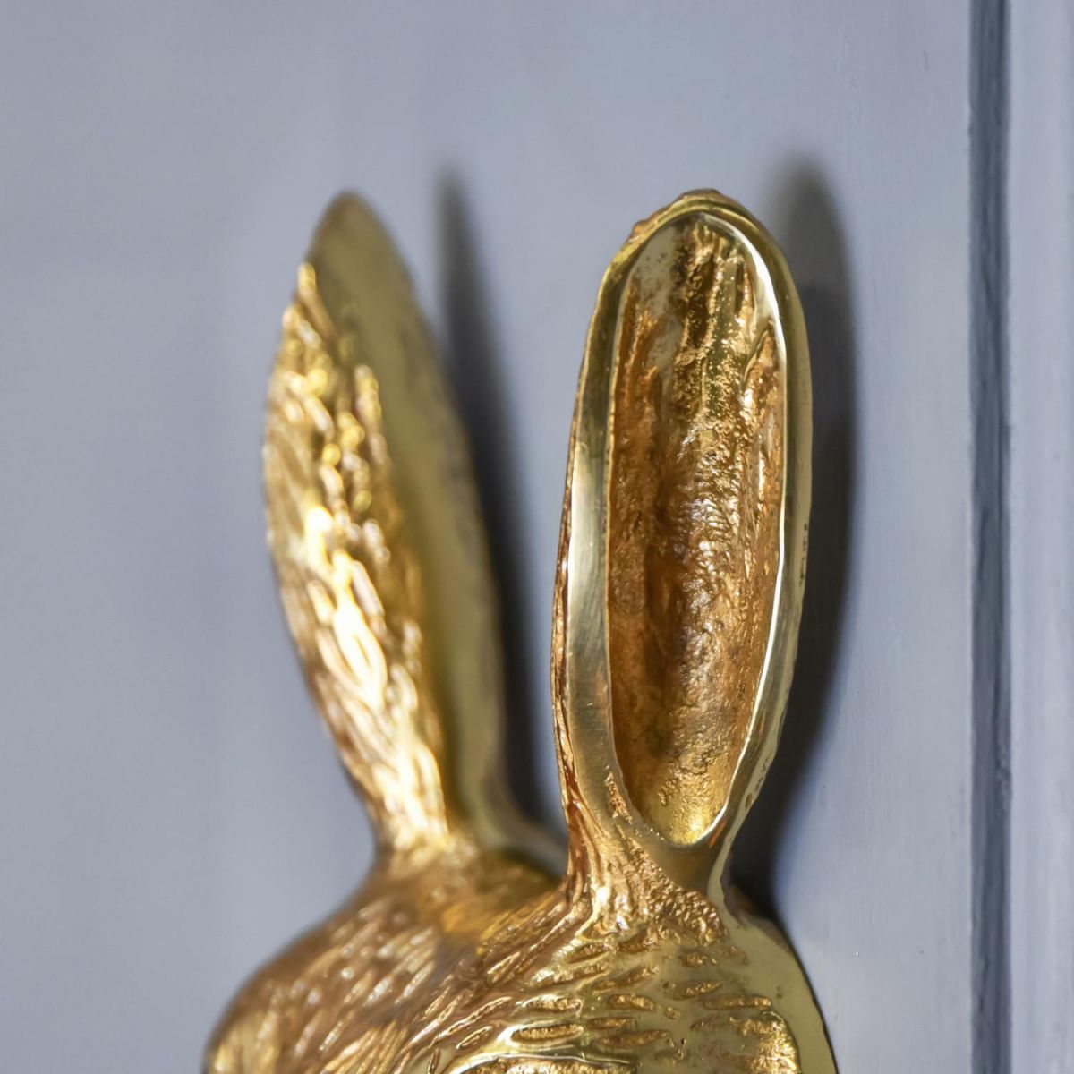 Close-Up of Rabbit Ears on Polished Brass Rabbit Door Knocker 